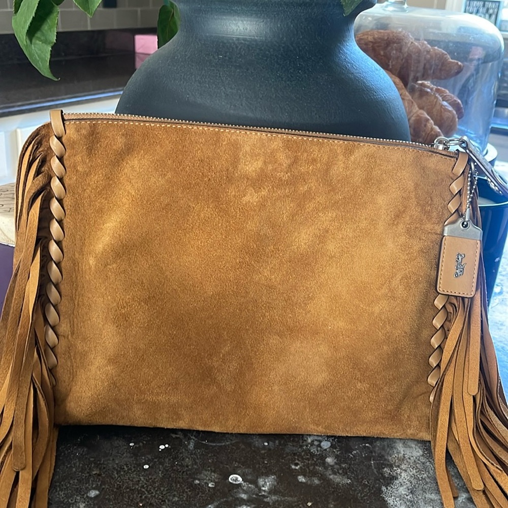 Coach genuine suede clutch fringe excellent condition inside few stains